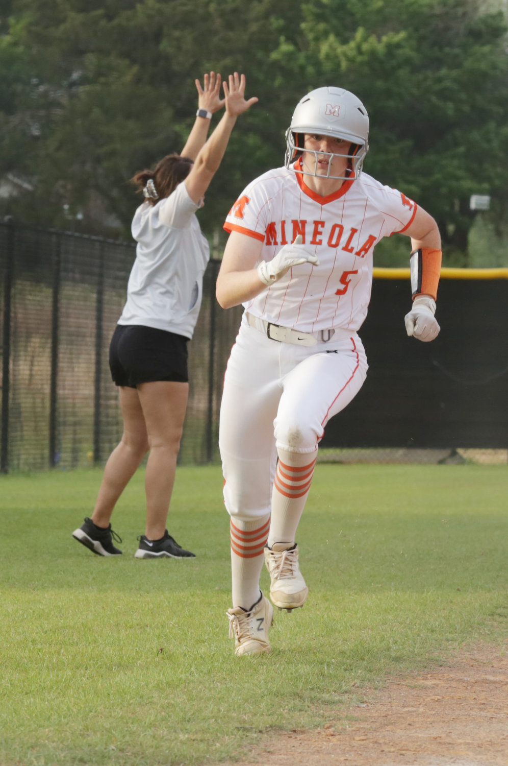 Mineola’s Jadelyn Marshall powers home courtesy a Jaycee Smith stand-up double in the first inning.
